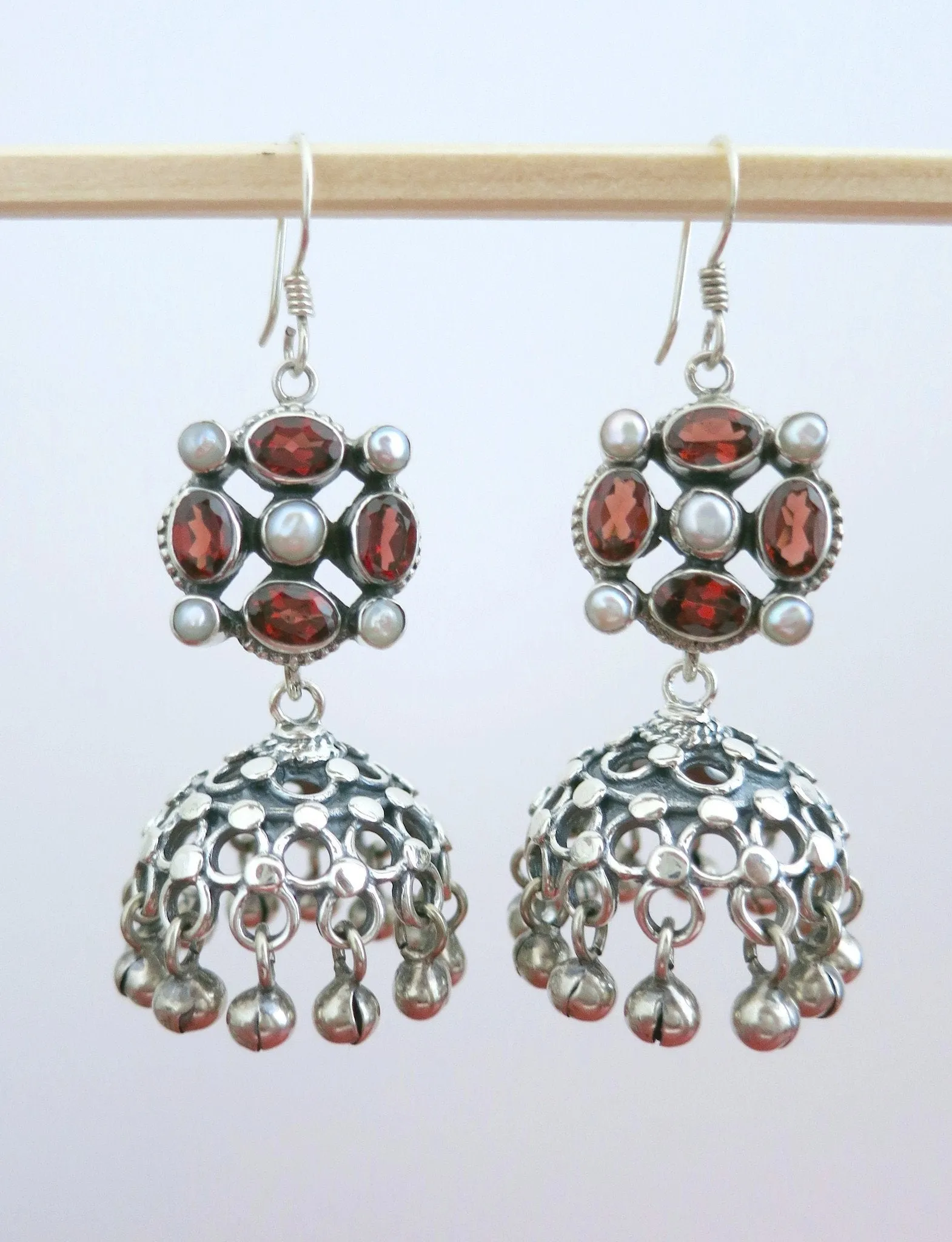 Classic and chic, detachable, jali jhumkas with garnet and pearl tops