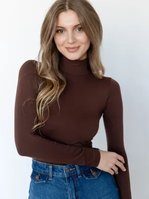 NIKIBIKI Long Sleeve Mock Neck Top