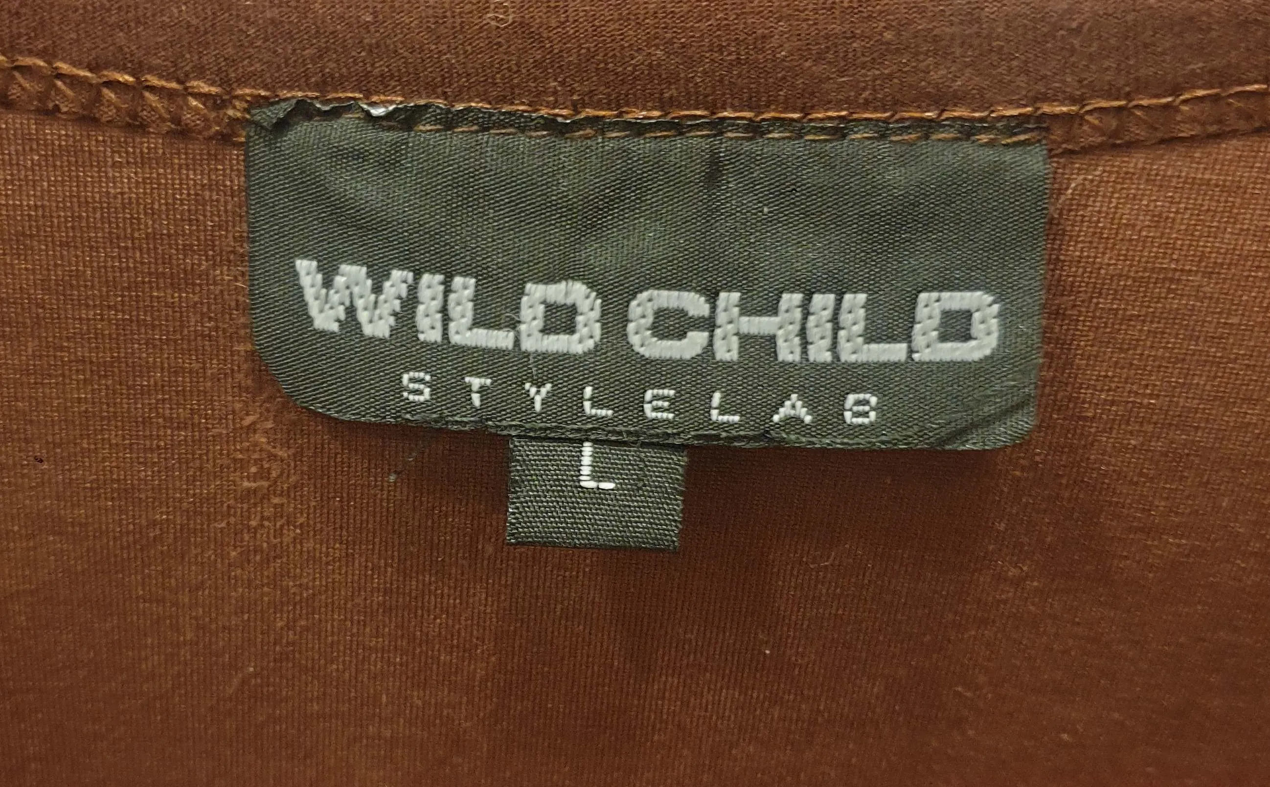 Wild Child brown tee shirt size L (tiny fit, best fits size 8)